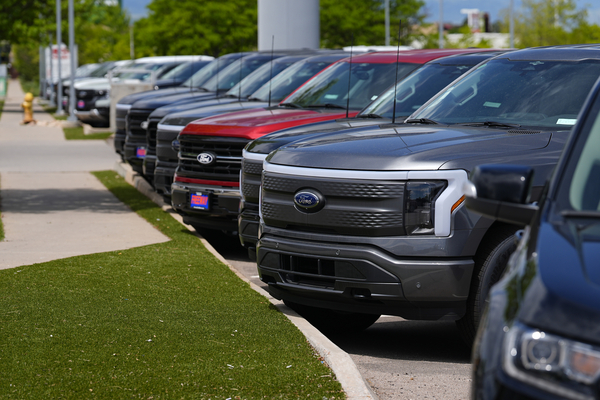 Ford F-150 electric and traditional trucks are lined up for sale at a dealership in Denver this spring.