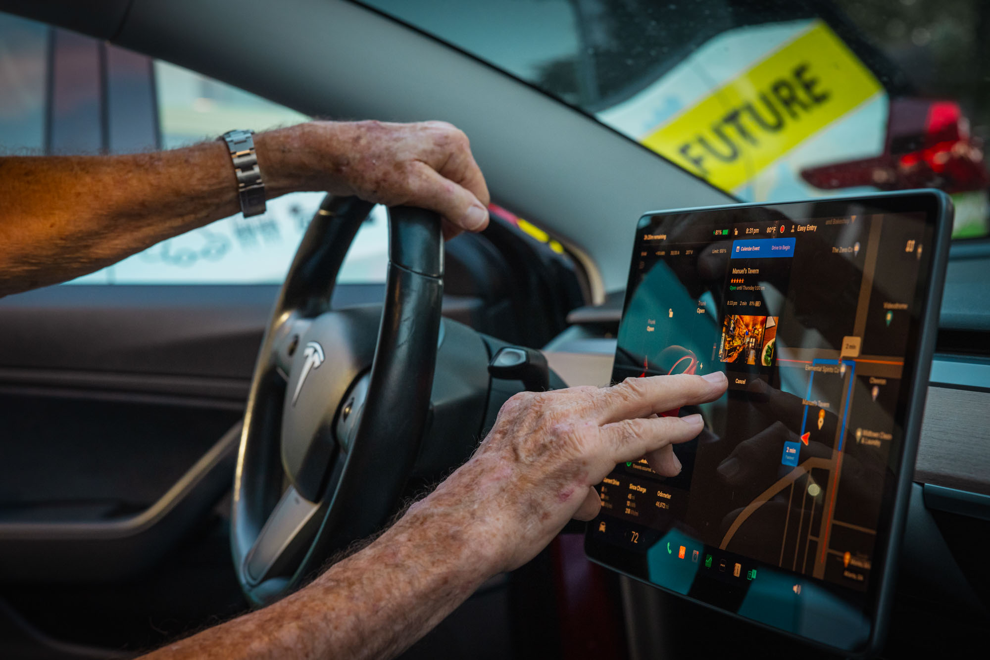 Francis rides in his Tesla after the EV club of the south's monthly meeting on May 15, 2024.